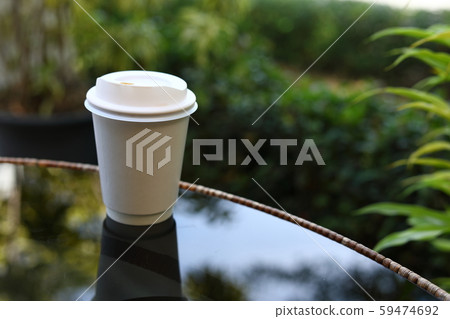 take away cup for hot coffee drink put on glass 59474692