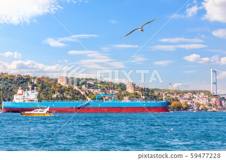 Big cargo ship in the Bosphorus near the Rumelian castle, Istanbul Big cargo ship in the Bosphorus near the Rumelian castle, Istanbul 59477228