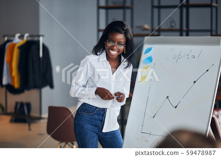 good-looking black business lady explain business strategy to young leaders good-looking black business lady explain business strategy to young leaders 59478987