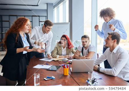 Shocked business team together in office 59479484