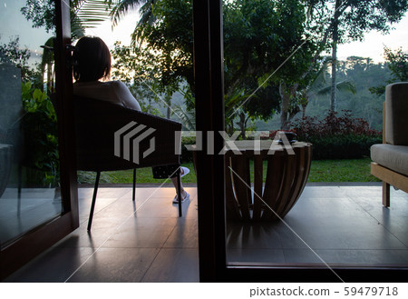 A beautiful young woman drnking tea and relaxing in the morning 59479718