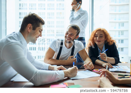 Young group of coworkers discussing in Conference Room with panoramic window 59479786