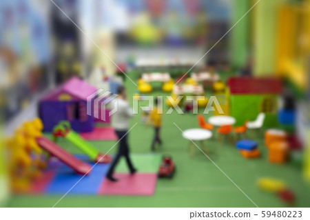 Blurred image of son and dad in Children's Commercial Indoor Playground. Blurred image of son and dad in Children's Commercial Indoor Playground. 59480223