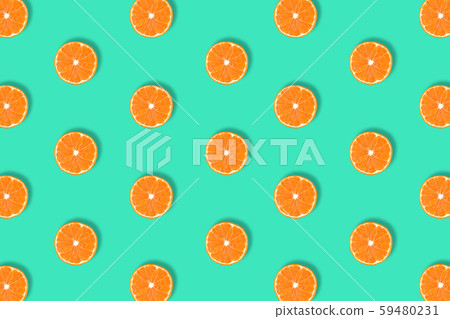 Fruit pattern of fresh mandarin slices on blue background. 59480231