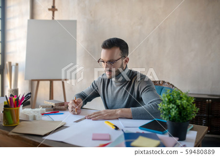 Experienced interior designer feeling involved in work 59480889