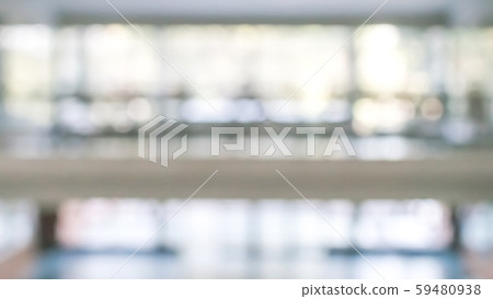 Blur background interior view looking out toward to empty office lobby and entrance doors and glass curtain wall Blur background interior view looking out toward to empty office lobby and entrance doors and glass curtain wall 59480938