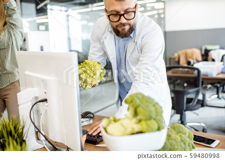 Senior nutritionist working in the office 59480998