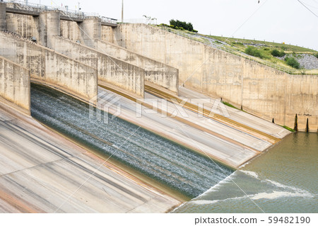 Dam with less water due to drought. Dam with less water due to drought. 59482190