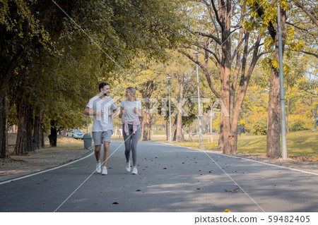 Couples are exercising in the park. Couples are exercising in the park. 59482405
