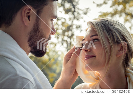 Young couples are wiping sweat after exercising. Young couples are wiping sweat after exercising. 59482408