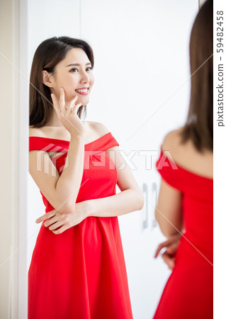 asian girl trying dress happily asian girl trying dress happily 59482458