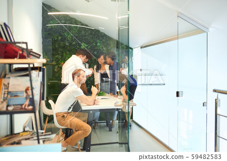 Business discussion of young team of diverse people Business discussion of young team of diverse people 59482583