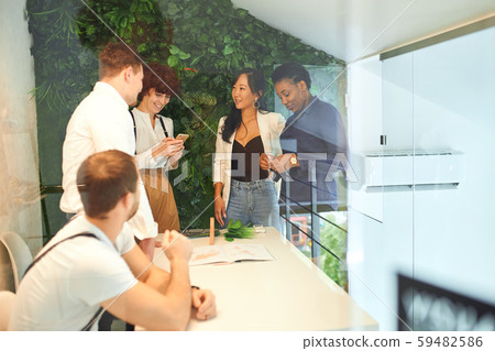 Business discussion of young team of diverse people Business discussion of young team of diverse people 59482586