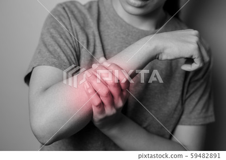 Woman suffering from pain in arm. Woman suffering from pain in arm. 59482891