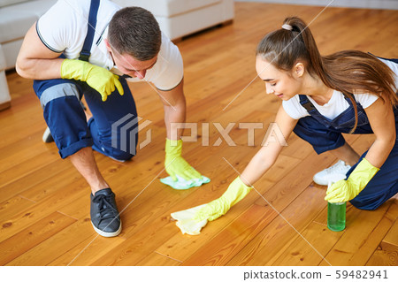 Team of two cleaners polish floor Team of two cleaners polish floor 59482941