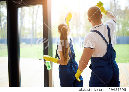 Professional workers clean panoramic window 59483296