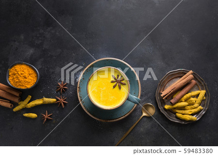 Cup of ayurvedic golden turmeric milk with curcuma Cup of ayurvedic golden turmeric milk with curcuma 59483380