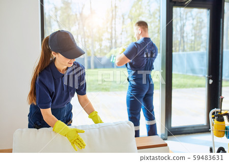 Man and woman do spring-cleaning in new house Man and woman do spring-cleaning in new house 59483631