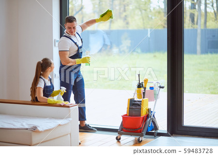 Young professional cleaners cleaning new house 59483728