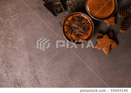 Brown background with two cups of hot drinks Brown background with two cups of hot drinks 59484140