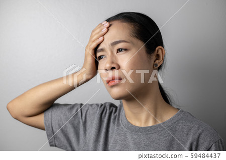 Young woman with of stress and headaches. Young woman with of stress and headaches. 59484437
