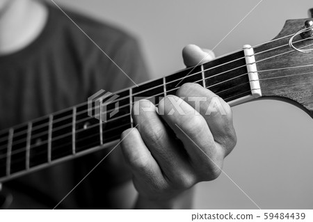 Musicians are catching guitar chords. 59484439