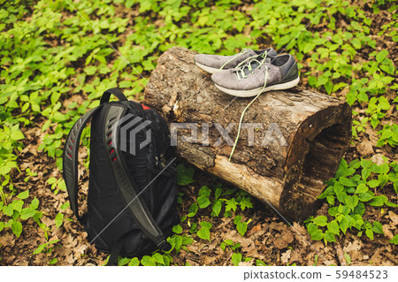 Sneakers for running standing on stump with backpack 59484523