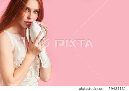 Beautiful redhaired lady with pigeon 59485181