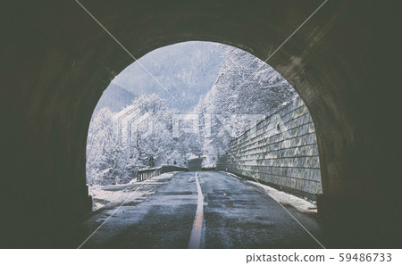 Exit from the tunnel with a view of high snow Exit from the tunnel with a view of high snow 59486733