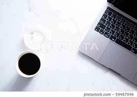Working on a laptop while drinking coffee. Business or work. At-home work, telework and side jobs. Working on a laptop while drinking coffee. Business or work. At-home work, telework and side jobs. 59487046
