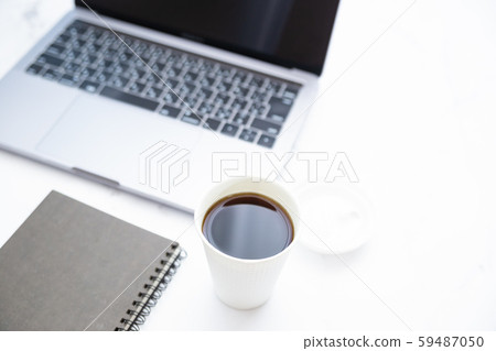 Working on a laptop while drinking coffee. Business or work. At-home work, telework and side jobs. Working on a laptop while drinking coffee. Business or work. At-home work, telework and side jobs. 59487050