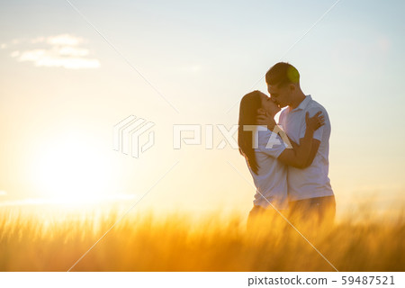 Love Couple in romantic summer field Love Couple in romantic summer field 59487521