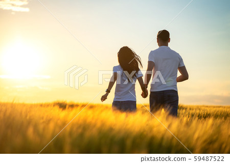 Love Couple running in romantic summer field Love Couple running in romantic summer field 59487522