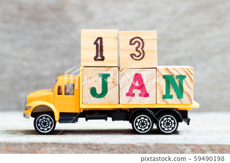 Truck hold letter block in word 13jan on wood background  59490198