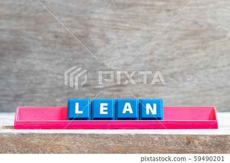 Tile letter on red rack in word lean on wood background  59490201