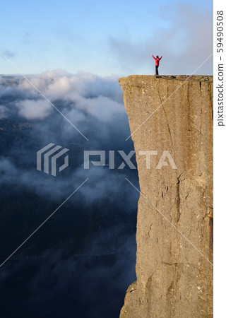 Cliff Preikestolen at fjord Lysefjord, Norway 59490508