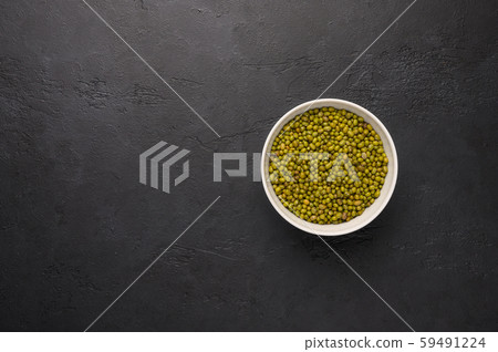 Bowl of mash on a textured wooden black background. Vegetable protein healthy food Bowl of mash on a textured wooden black background. Vegetable protein healthy food 59491224