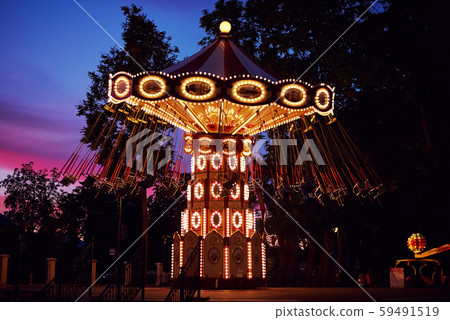 Carousel Merry go round in amusement park at night city 59491519