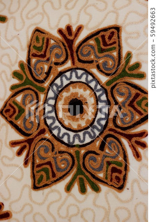Handmade decoration on fabric. 59492663