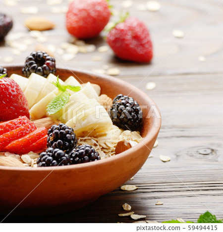 Fruit healthy muesli with banana strawberry 59494415