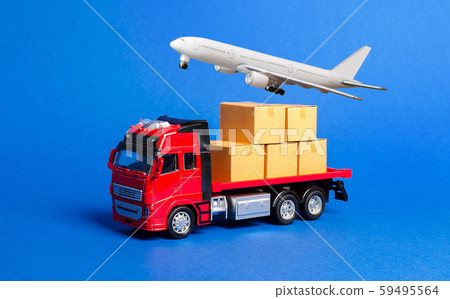 A red truck with boxes and cargo plane. Goods transportation services company. Logistics and infrastructure. Warehousing and supply. Optimization of delivery. Import and export of products A red truck with boxes and cargo plane. Goods transportation services company. Logistics and infrastructure. Warehousing and supply. Optimization of delivery. Import and export of products 59495564