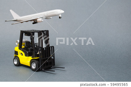 Yellow forklift truck Yellow forklift truck on gray background. Warehouse equipment, vehicle. Logistics and transport infrastructure, industry and agriculture. Unloading, transportaon gray background. 59495565