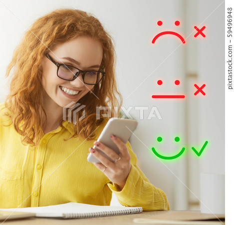 Red-haired woman giving high marks for service 59496948