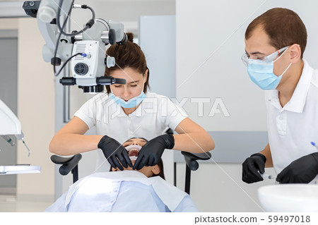 High class service in dental cabinet, dentist making surgery High class service in dental cabinet, dentist making surgery 59497018