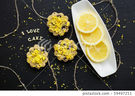 lemon cupcakes on a black background 59497251