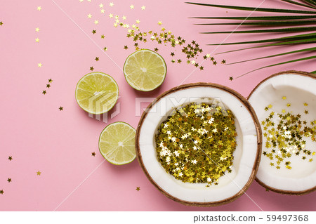 Coconut and palm with golden stars confetti on pink color paper background minimal style Coconut and palm with golden stars confetti on pink color paper background minimal style 59497368