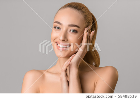 Youth and beauty. Young girl touching her face 59498539