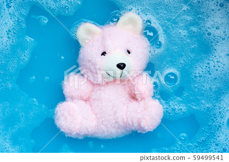 Soak toy bear in laundry detergent water Soak toy bear in laundry detergent water 59499541