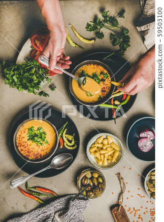 Man eating turkish traditional lentil soup Man eating turkish traditional lentil soup 59503100