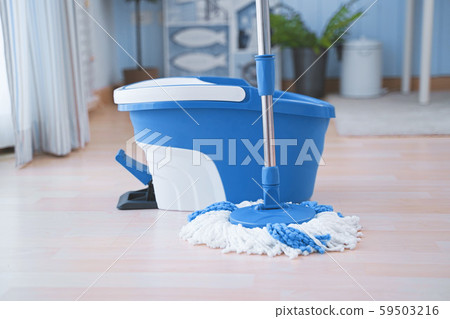 Floor cleaning with mob and bucket. Cleaning floor in the room. 59503216